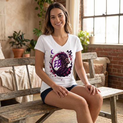 Model seated on a wooden bench wearing EB Lion V-Neck T-Shirt, showcasing its contoured fit, side seams, and casual style in a cozy studio setting.